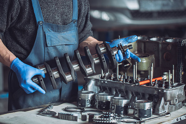 automotive-mechanic-repairing-an-engine automotive-mechanic-repairing-an-engine